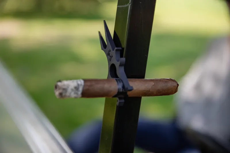 Putt & Puff mounted on golf cart with cigar